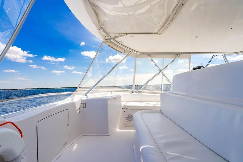 Slide: The Image of Luxurious 2006 Viking 56 Convertible yacht interior with ocean view and clear blue sky. - 20