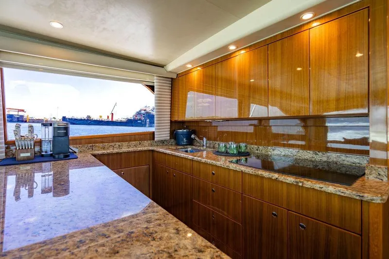 Slide: The Image of Luxurious kitchen interior of 2006 Viking 56 Convertible yacht with ocean view. - 25