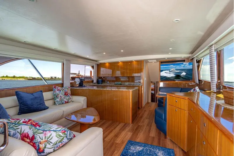 Slide: The Image of Luxurious interior of a 2006 Viking 56 Convertible yacht with elegant wood finishes. - 27