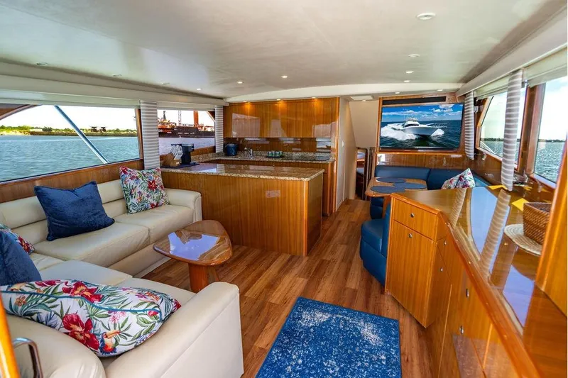 Slide: The Image of Luxurious interior of 2006 Viking 56 Convertible yacht with elegant wood finishes and plush seating. - 28