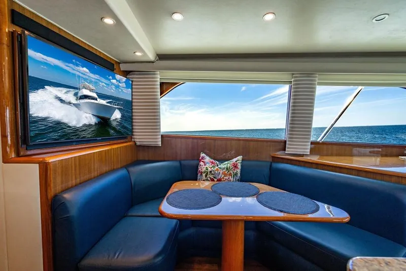 Slide: The Image of Luxurious interior of 2006 Viking 56 Convertible yacht with ocean view and plush seating. - 29
