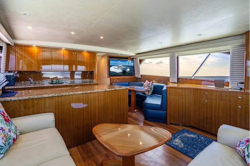 Slide: The Image of Luxurious interior of a 2006 Viking 56 Convertible yacht with elegant wood finishes. - 31