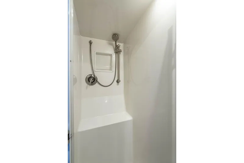 Slide: The Image of Shower area in 2006 Viking 56 Convertible yacht, featuring modern fixtures and white interior. - 44