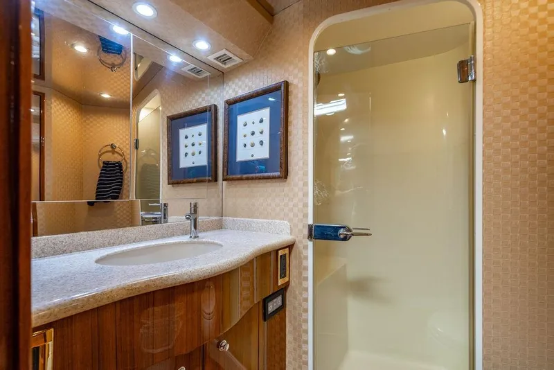 Slide: The Image of Luxurious bathroom in 2006 Viking 56 Convertible yacht with modern fixtures and elegant design. - 46
