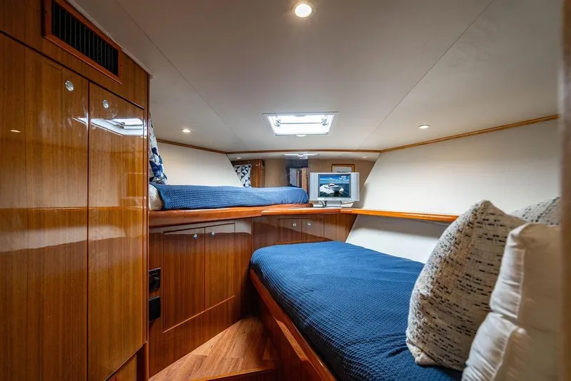 Slide: The Image of Luxurious cabin interior of 2006 Viking 56 Convertible yacht with twin beds. - 49