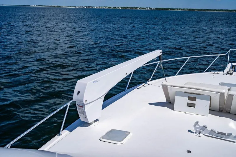 Slide: The Image of 2006 Viking 56 Convertible yacht deck with ocean view and clear blue sky. - 54