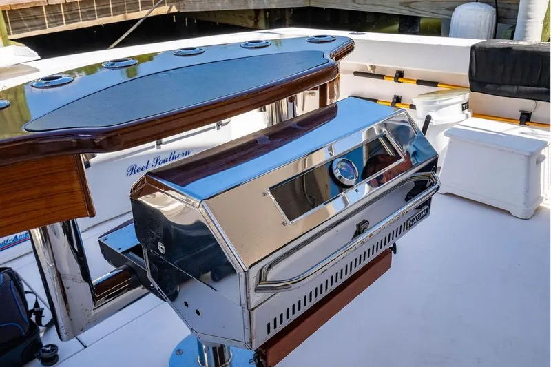 Slide: The Image of Luxury Viking 56 Convertible yacht deck with grill and seating, 2006 model. - 67