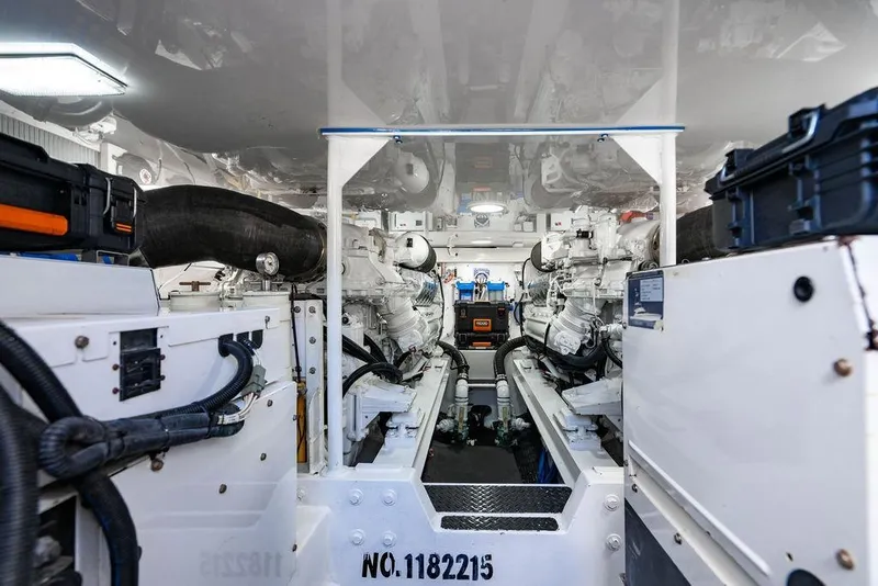 Slide: The Image of Engine room of a 2006 Viking 56 Convertible yacht, showcasing dual engines and mechanical systems. - 70
