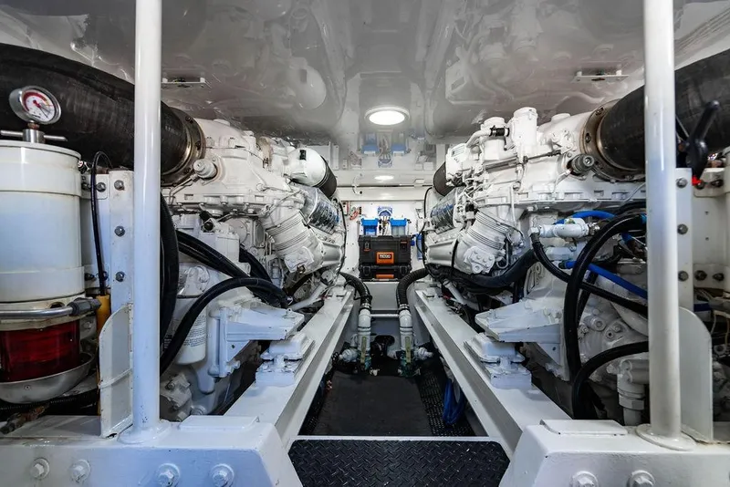 Slide: The Image of Engine room of 2006 Viking 56 Convertible yacht, showcasing dual engines and mechanical components. - 71