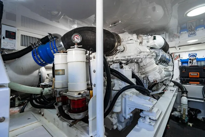 Slide: The Image of Engine room of a 2006 Viking 56 Convertible yacht, showcasing machinery and components. - 72
