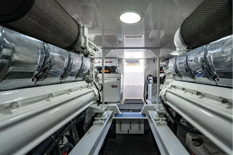 Slide: The Image of Engine room of 2006 Viking 56 Convertible yacht, showcasing dual engines and clean design. - 76