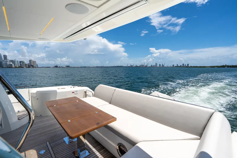 Slide: The Image of Luxury yacht Prestige 520 cruising with city skyline and ocean view, 2023 model. - 19