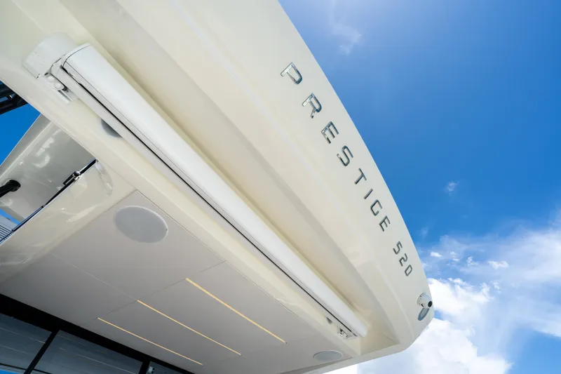 Slide: The Image of Luxury yacht Prestige 520, 2023 model, against a clear blue sky. - 22