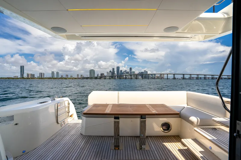 Slide: The Image of Luxury yacht deck view with city skyline, Prestige 520, 2023 model. - 23