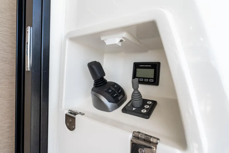 Slide: The Image of Control panel of 2023 Prestige 520 yacht featuring Volvo Penta joystick and display. - 27