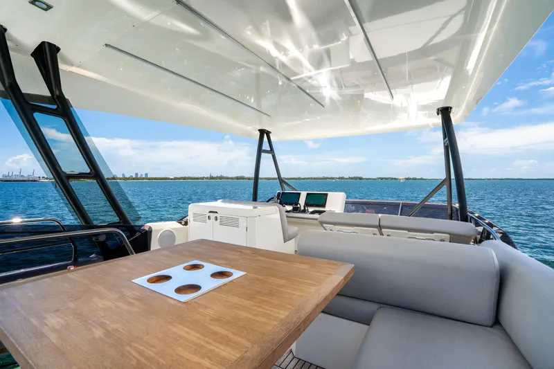 Slide: The Image of Luxurious 2023 Prestige 520 yacht deck with seating and ocean view. - 36