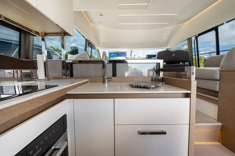 Slide: The Image of Modern kitchen interior of 2023 Prestige 520 yacht, featuring sleek design and ample natural light. - 42
