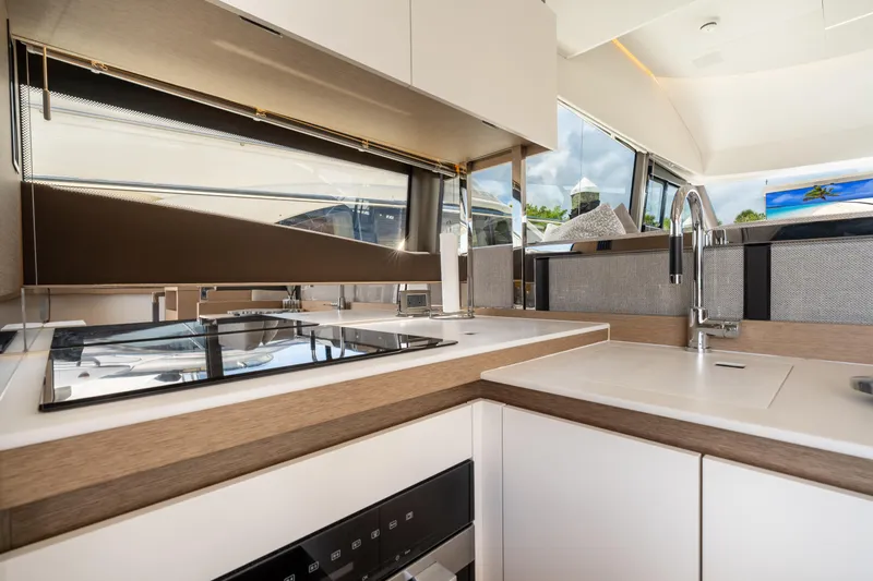Slide: The Image of Modern kitchen interior on 2023 Prestige 520 yacht, featuring sleek design and high-end appliances. - 43