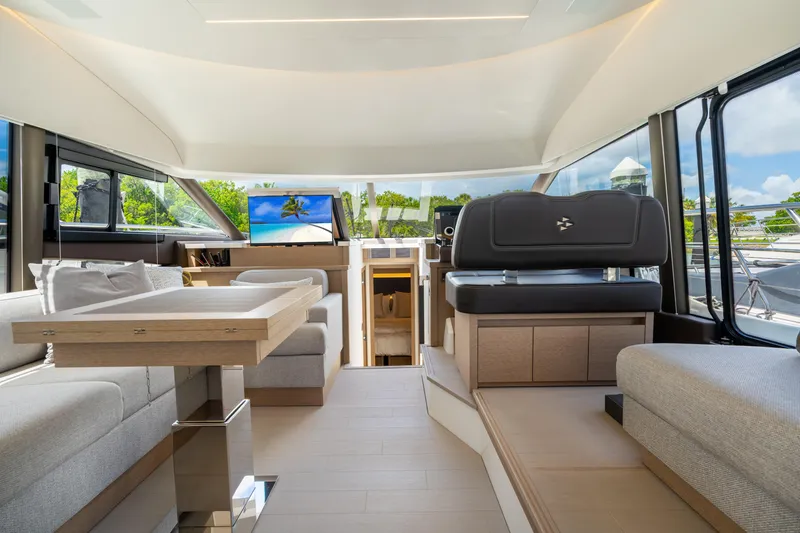 Slide: The Image of Luxurious interior of 2023 Prestige 520 yacht with modern seating and panoramic windows. - 46