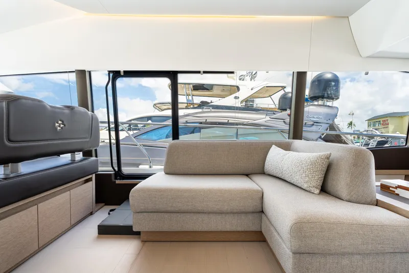 Slide: The Image of Luxurious interior of 2023 Prestige 520 yacht with modern seating and large windows. - 47