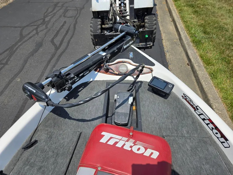 Slide: The Image of 1998 Triton Tr-17 boat with trolling motor and fish finder on deck. - 18