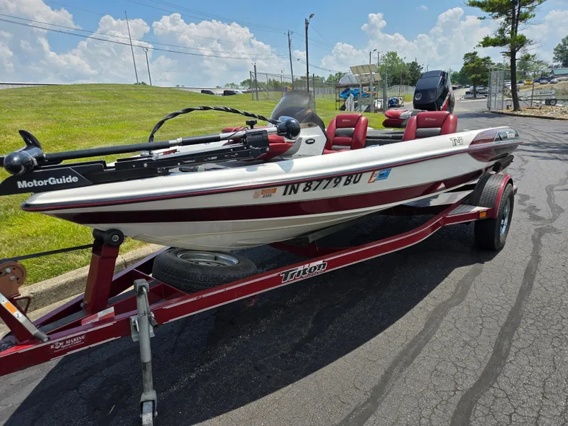 Slide: The Image of 1998 Triton Tr-17 boat on trailer, red and white, with MotorGuide trolling motor. - 6