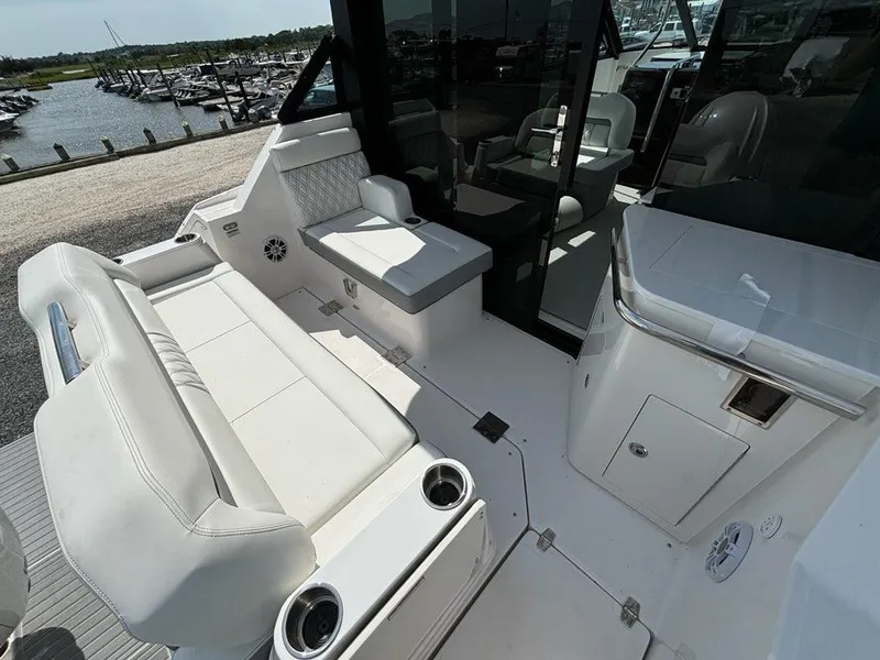 Slide: The Image of Luxurious interior of 2025 Regal 36 XO yacht with white seating and modern amenities. - 37