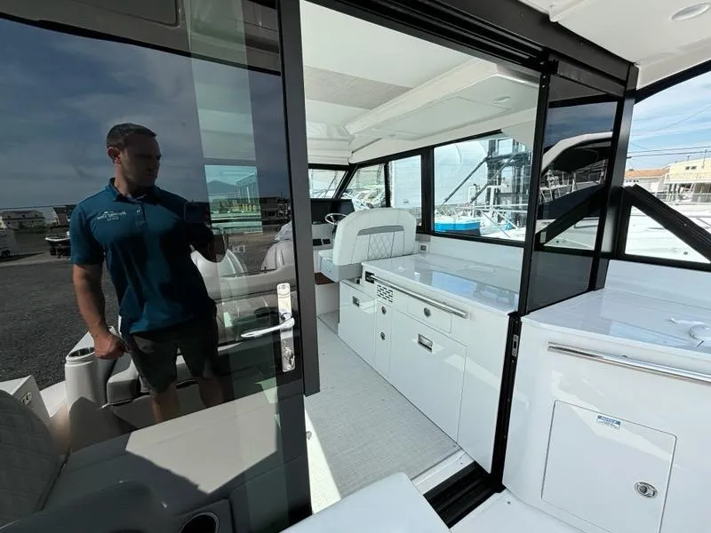 Slide: The Image of 2025 Regal 36 XO yacht interior with modern design and sleek white cabinetry. - 38