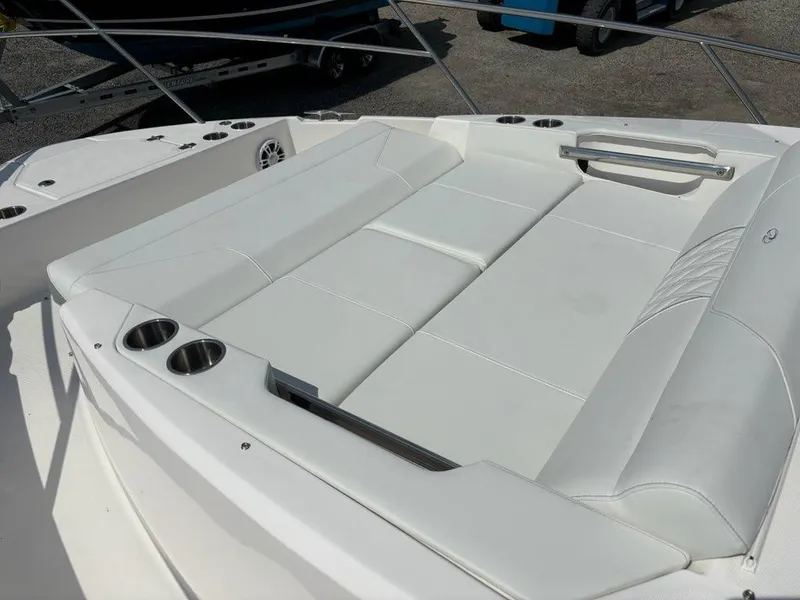 Slide: The Image of Luxurious seating area on 2025 Regal 36 XO boat with cup holders. - 48