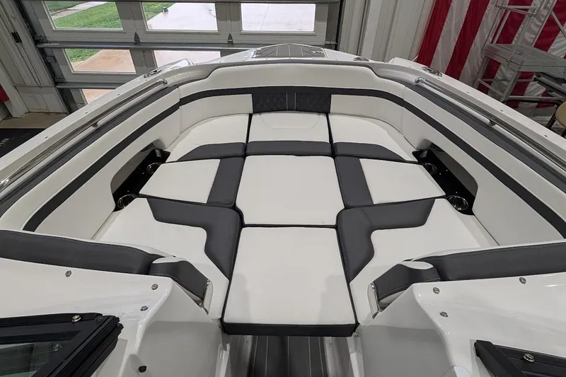 Slide: The Image of Luxurious seating area on a 2026 Monterey M-65 boat, featuring sleek black and white upholstery. - 22
