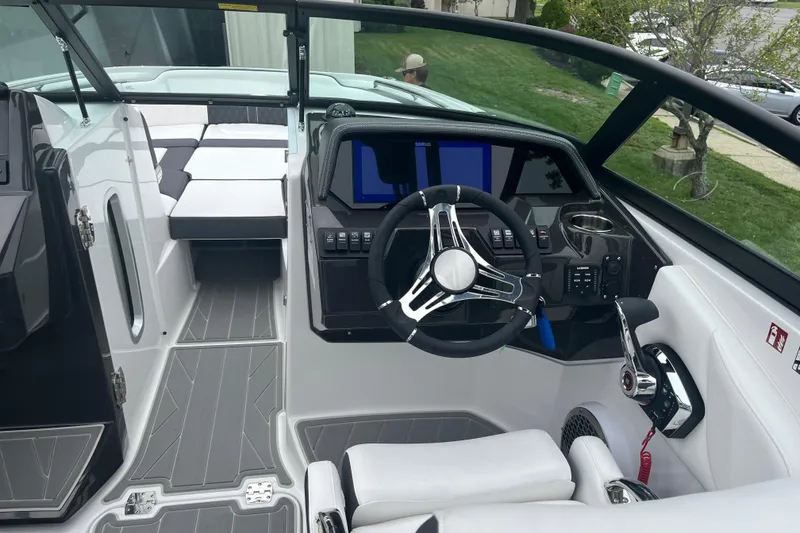 Slide: The Image of Interior of 2026 Monterey M-65 boat with modern steering and seating. - 4