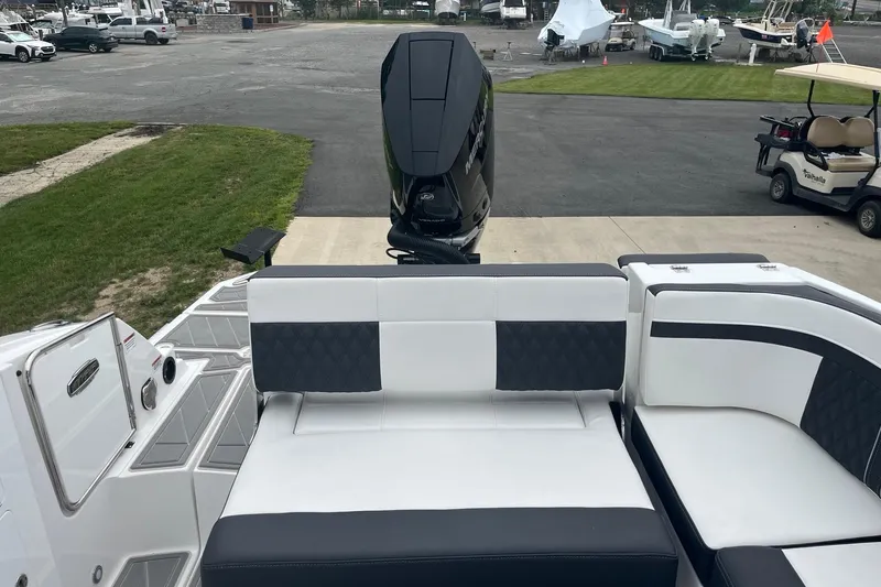 Slide: The Image of 2026 Monterey M-65 boat with sleek seating and powerful outboard motor. - 5