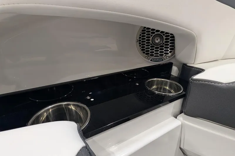 Slide: The Image of Interior of 2026 Monterey M-65 boat with cup holders and speaker. - 24
