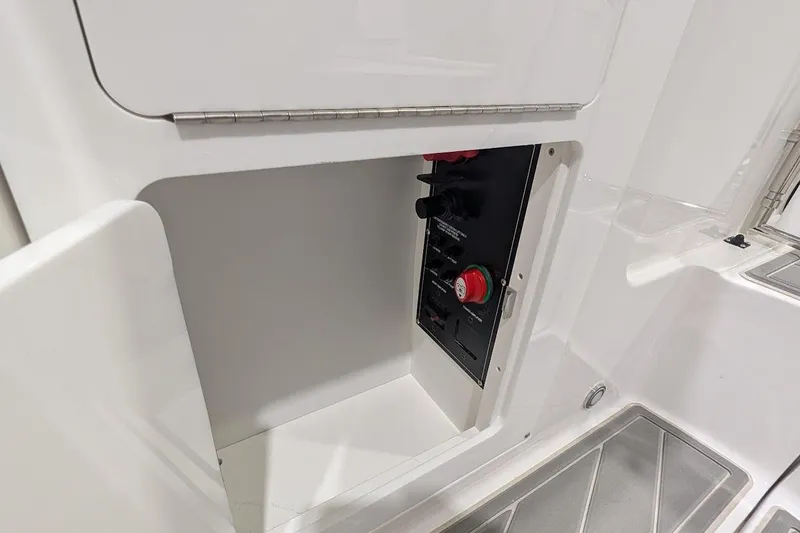 Slide: The Image of Control panel inside a compartment of a 2026 Monterey M-65 boat. - 30