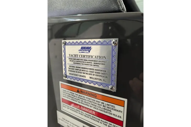 Slide: The Image of Yacht certification plaque on 2026 Monterey M-65, highlighting safety compliance and warnings. - 19