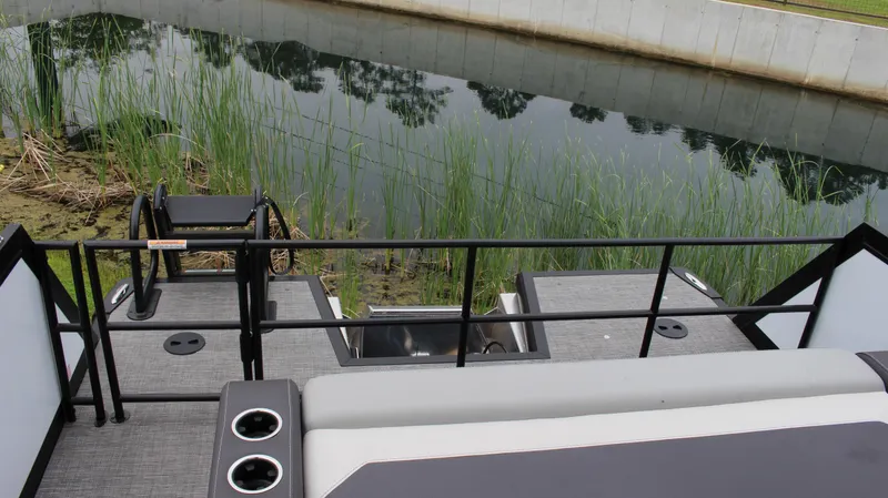 Slide: The Image of 2025 Viaggio Diamante U boat deck overlooking a serene waterway with reeds. - 15