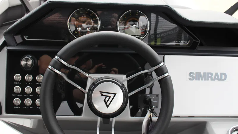 Slide: The Image of Steering wheel and dashboard of 2025 Viaggio Diamante U boat with Simrad display. - 19
