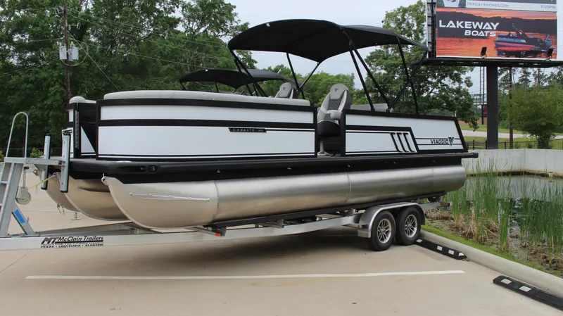 Slide: The Image of 2025 Viaggio Diamante U pontoon boat on trailer in parking lot. - 8