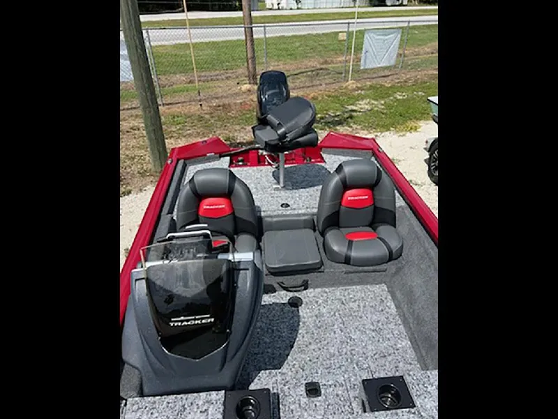 Slide: The Image of 2025 Tracker Pro Team 175 boat interior with gray and red seating. - 6