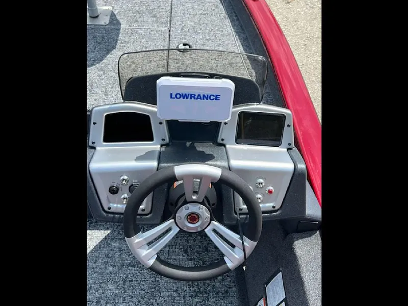 Slide: The Image of 2025 Tracker Pro Team 175 boat dashboard with Lowrance electronics and steering wheel. - 7