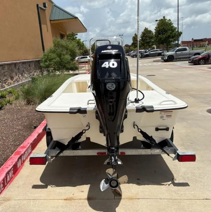 Slide: The Image of 2024 Mako Pro Skiff 13 CC with Mercury 40 engine on trailer. - 3