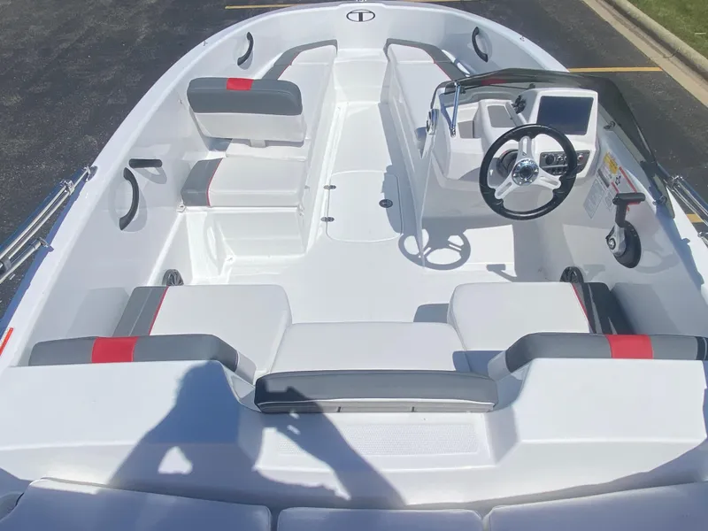 Slide: The Image of 2025 Tahoe T16 boat interior with modern seating and steering console. - 5