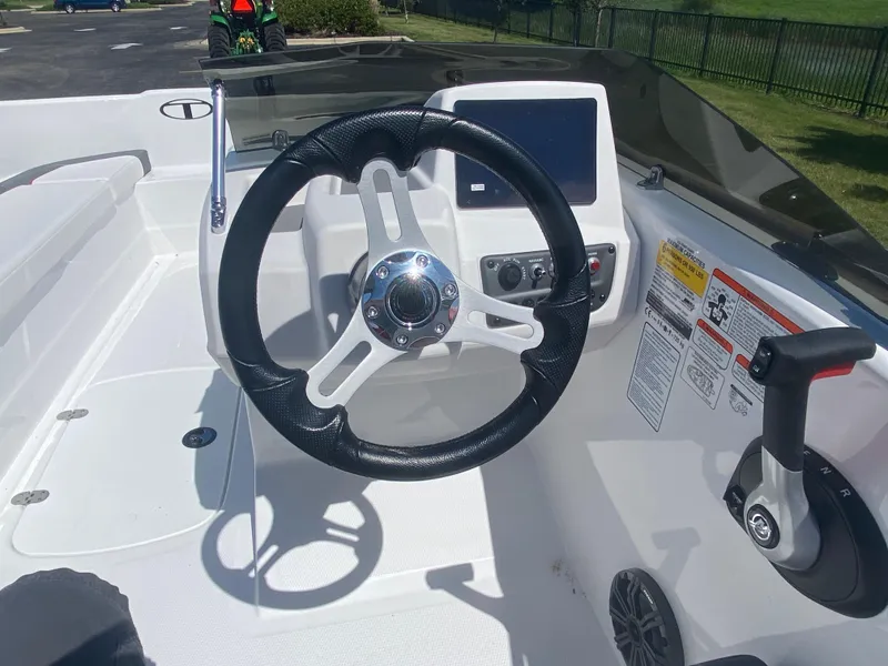Slide: The Image of 2025 Tahoe T16 boat cockpit with steering wheel and control panel. - 6