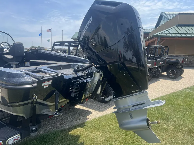 Slide: The Image of Nitro ZV21 Pro 2025 boat with Mercury outboard motor, parked outdoors. - 2