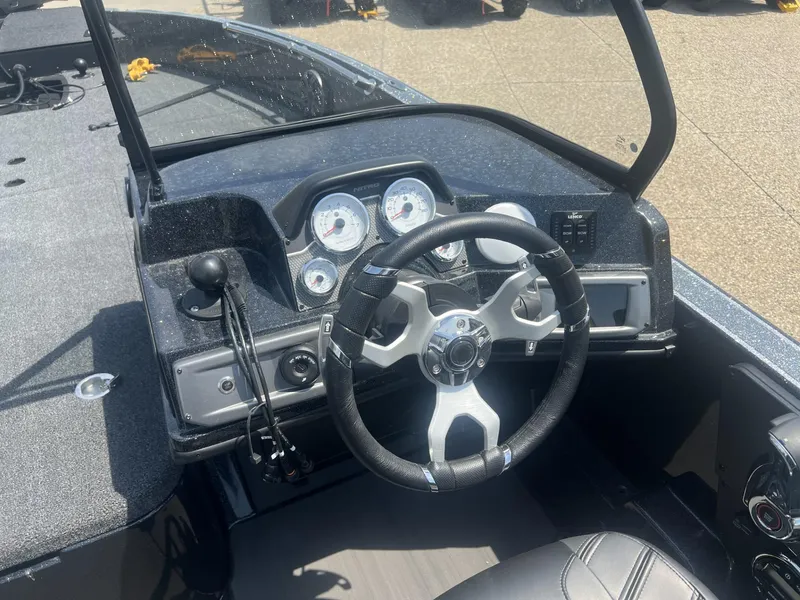 Slide: The Image of 2025 Nitro ZV21 Pro boat dashboard with steering wheel and gauges. - 4