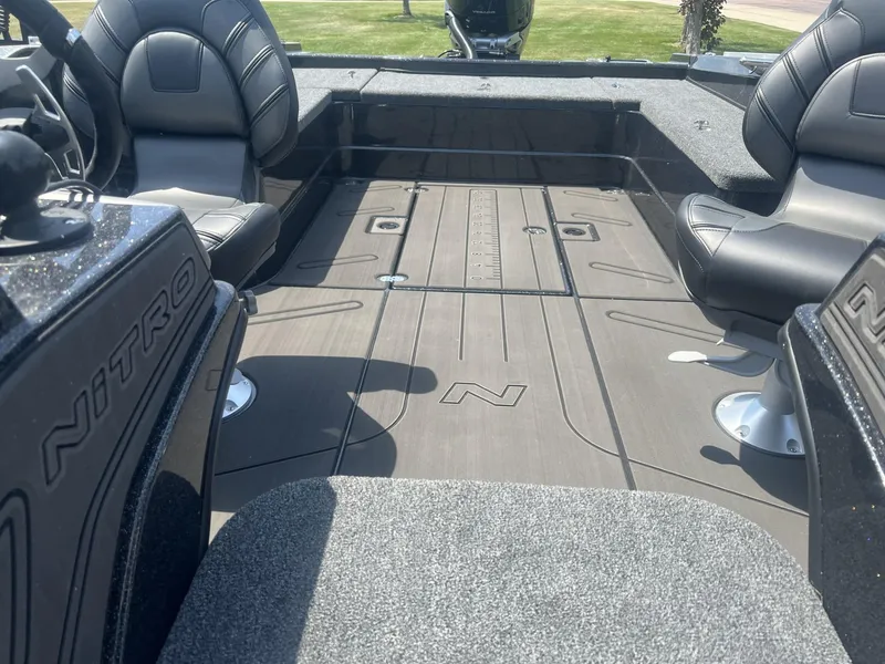Slide: The Image of 2025 Nitro ZV21 Pro boat interior with sleek seating and spacious deck design. - 5