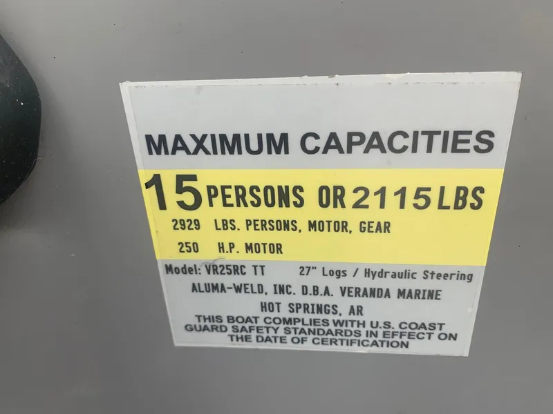 Slide: The Image of 2019 Veranda Relax VR25RC pontoon boat with spacious seating and canopy, parked outdoors. - 12