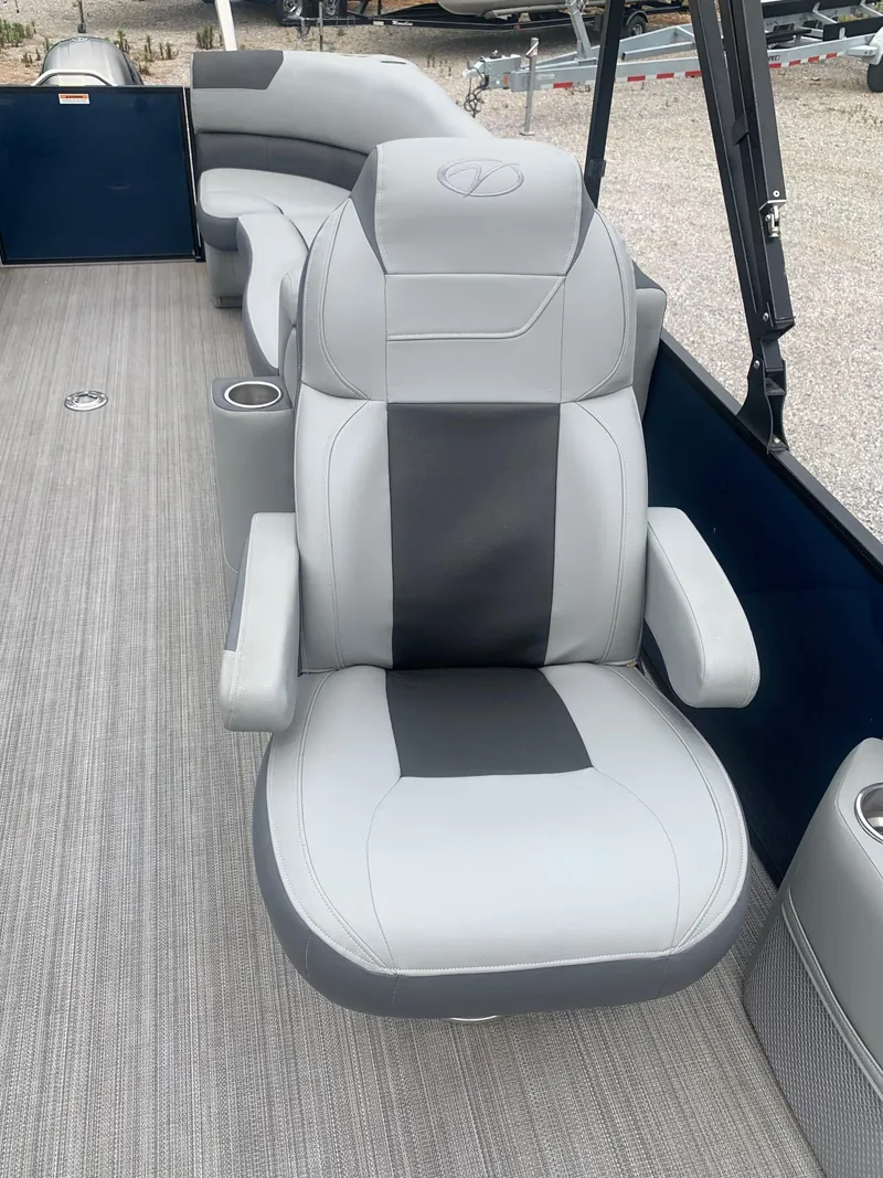 Slide: The Image of 2019 Veranda Relax VR25RC boat interior with gray seating and cup holders. - 17
