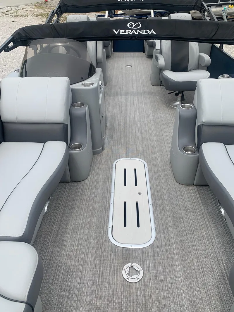 Slide: The Image of 2019 Veranda Relax VR25RC boat seating with gray upholstery and cup holder. - 9