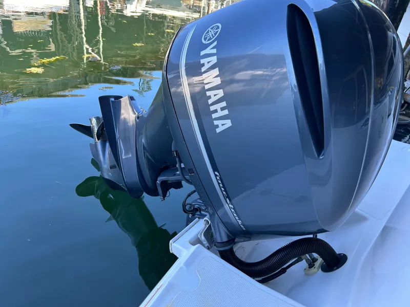 Slide: The Image of Yamaha outboard motor on 2017 Cutwater C-242 Coupe, docked on calm water. - 13